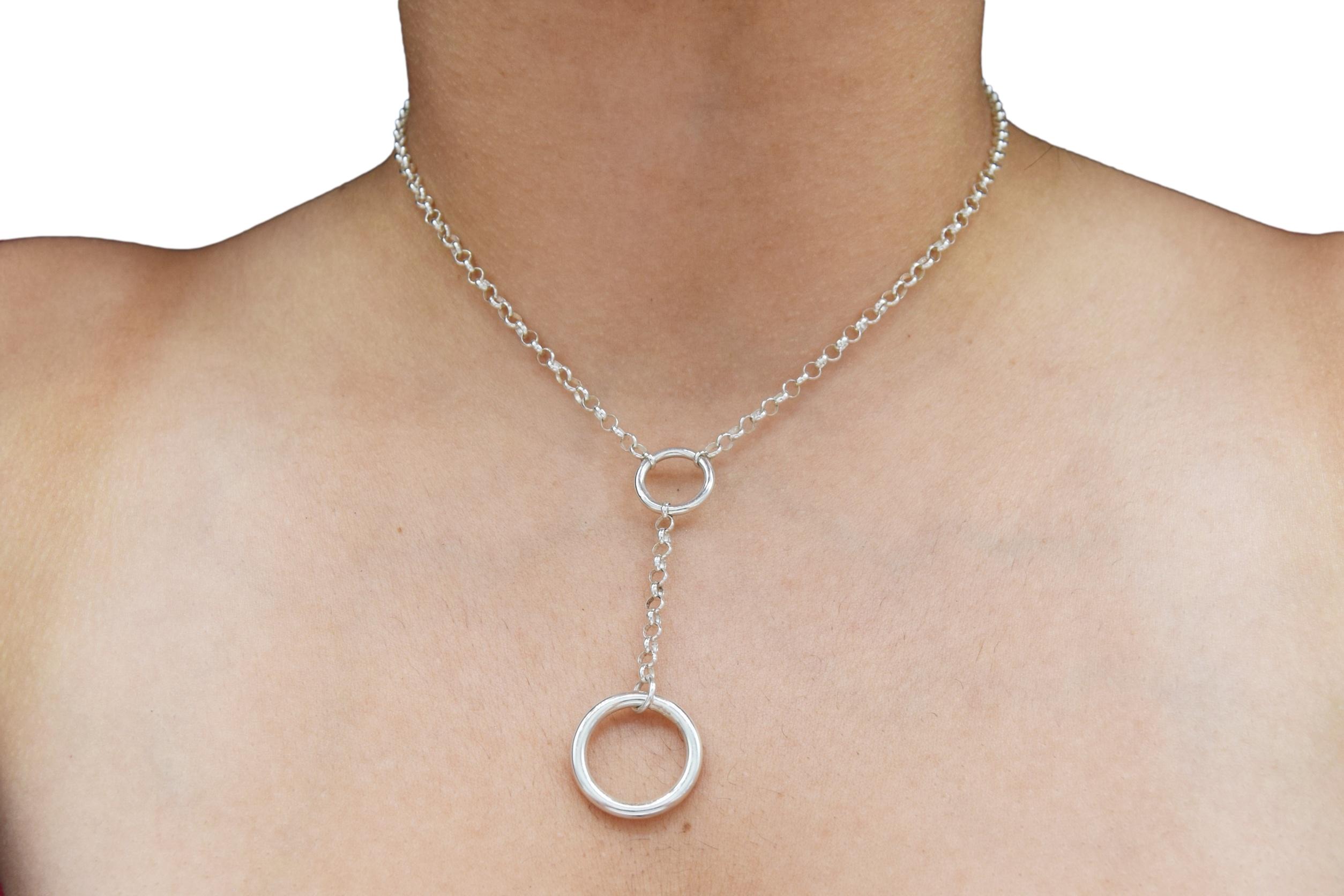 BDSM Locking Day Collar Jewelry Necklace of Lock and O ring available in solid 316L Stainless Steel or 925 sterling silver shown on a model's neck