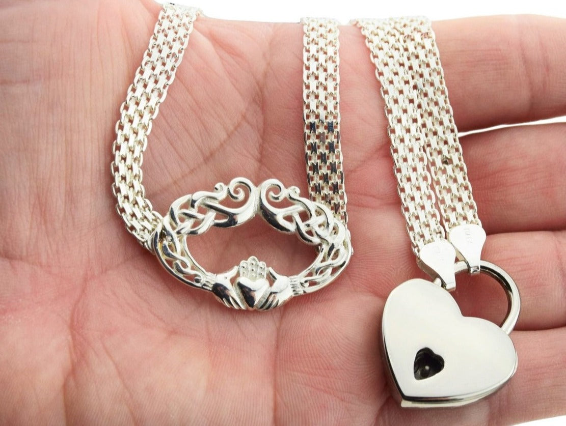 BDSM Locking Day Collar Jewelry Necklace of Lock and O ring with large sterling bell available in solid 316L Stainless Steel or 925 sterling silver shown on a model's hand