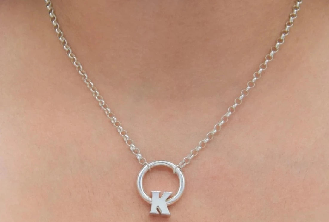 BDSM Locking Day Collar Jewelry Necklace of Lock and O ring available in solid 316L Stainless Steel or 925 sterling silver shown on a model's neck