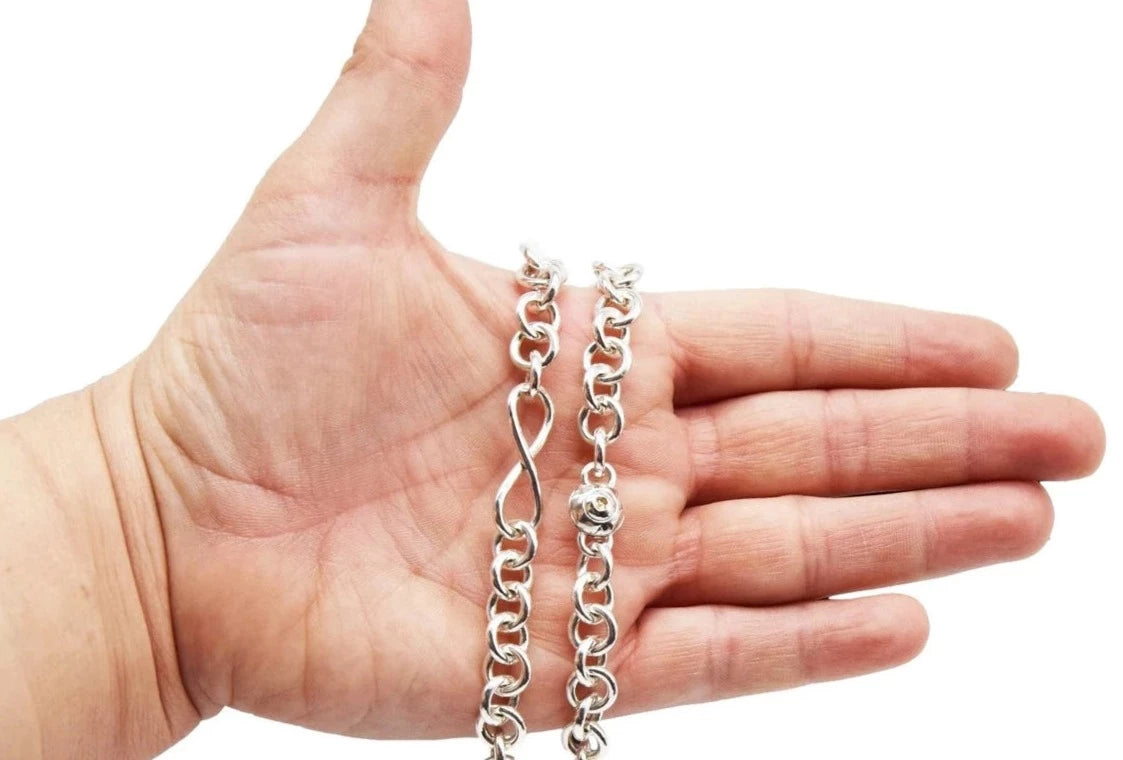 BDSM Locking Ankle Day Collar Jewelry Necklace of Lock and O ring with large sterling bell available in solid 316L Stainless Steel or 925 sterling silver shown on a model's hand for display