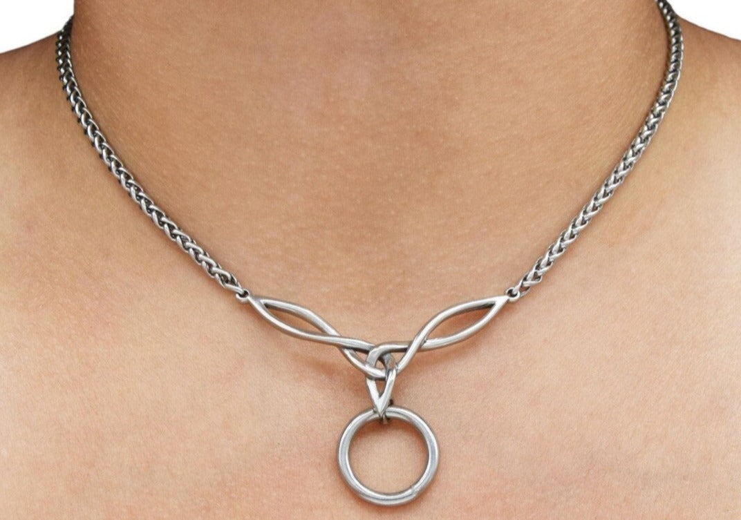BDSM Locking Celtic Knot Day Collar Jewelry Necklace of Lock and O ring available in solid 316L Stainless Steel or 925 sterling silver shown on a models neck
