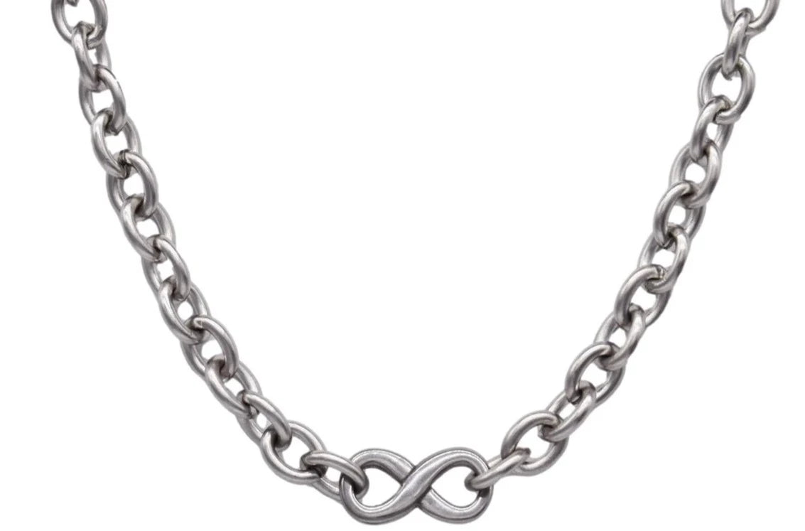 BDSM Locking Heavy Day Collar Jewelry Infinity Necklace of Lock and O ring in solid 316L Stainless Steel on a white background