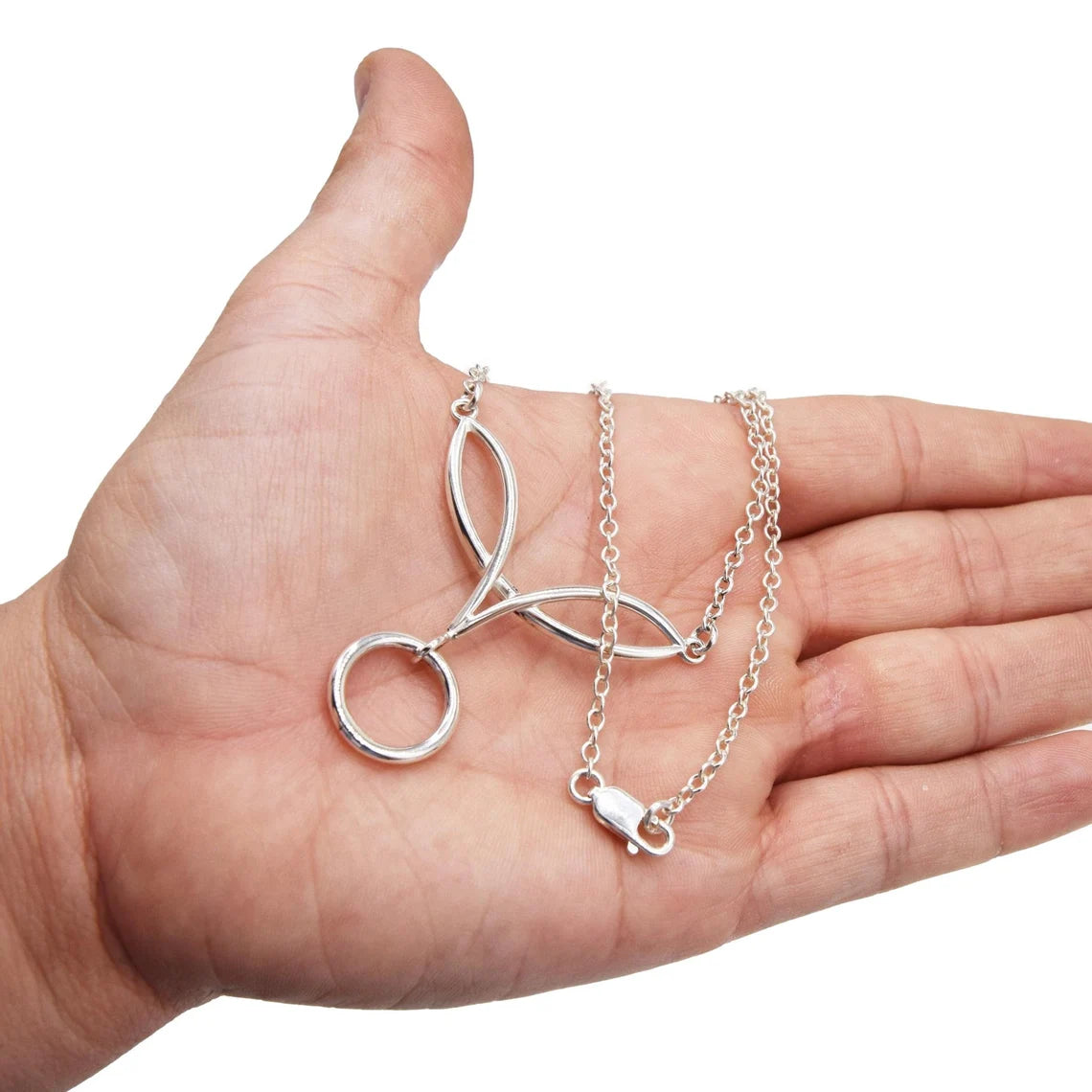 BDSM Locking Day Collar Jewelry Necklace of Lock and Celtic Knot w/ O ring with large sterling bell available in solid 316L Stainless Steel or 925 sterling silver shown on a model's hand