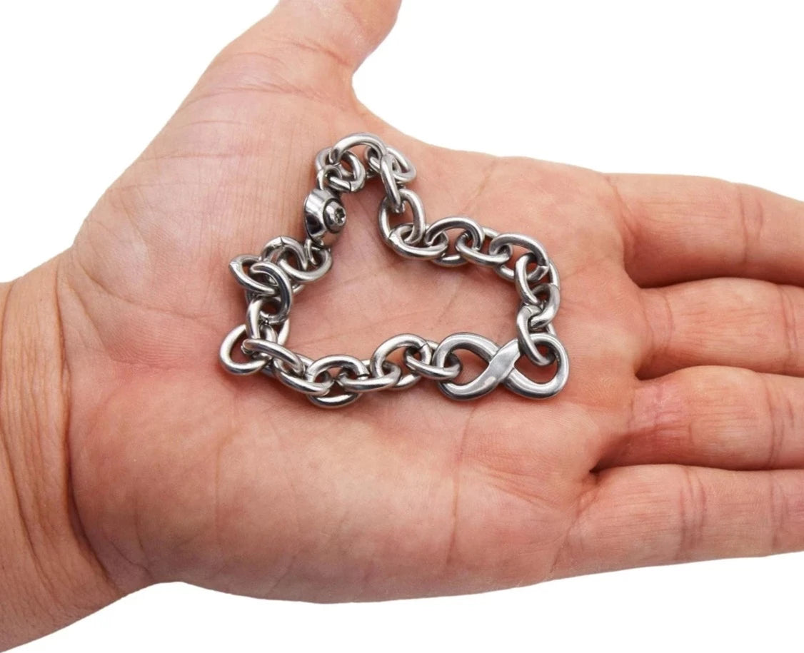 BDSM Locking Day Collar anklet Jewelry Necklace of Lock and O ring with large sterling bell available in solid 316L Stainless Steel or 925 sterling silver shown on a model's hand