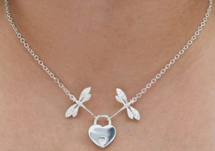 BDSM Locking Day Collar Jewelry Necklace with Lock and double dragonflies and options of O ring with large sterling bell available in solid 316L Stainless Steel or 925 sterling silver shown on a model's neck