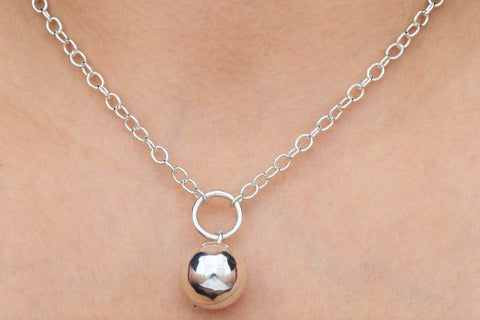 BDSM Locking Day Collar Jewelry Necklace of Lock and O ring  with large sterling bell available in solid 316L Stainless Steel or 925 sterling silver shown on a model's neck 