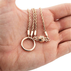 BDSM Locking Day Collar Jewelry Necklace of Lock and O ring with shibari chain  with large sterling bell available in solid 316L Stainless Steel or 925 sterling silver or 14K gold shown on a model's hand