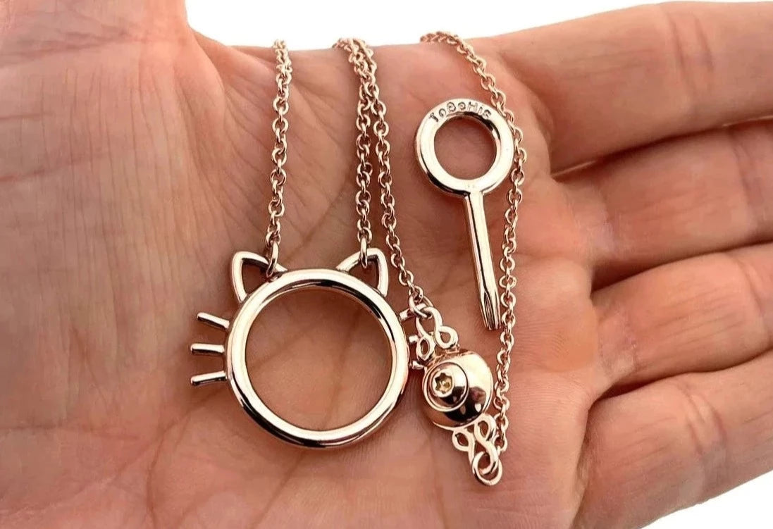 BDSM Locking Day Collar Kitty Cat jewelry Necklace of Lock and O ring  with large sterling bell available in solid 14K yellow, rose, or white Gold or 925 sterling silver shown on a  models hand