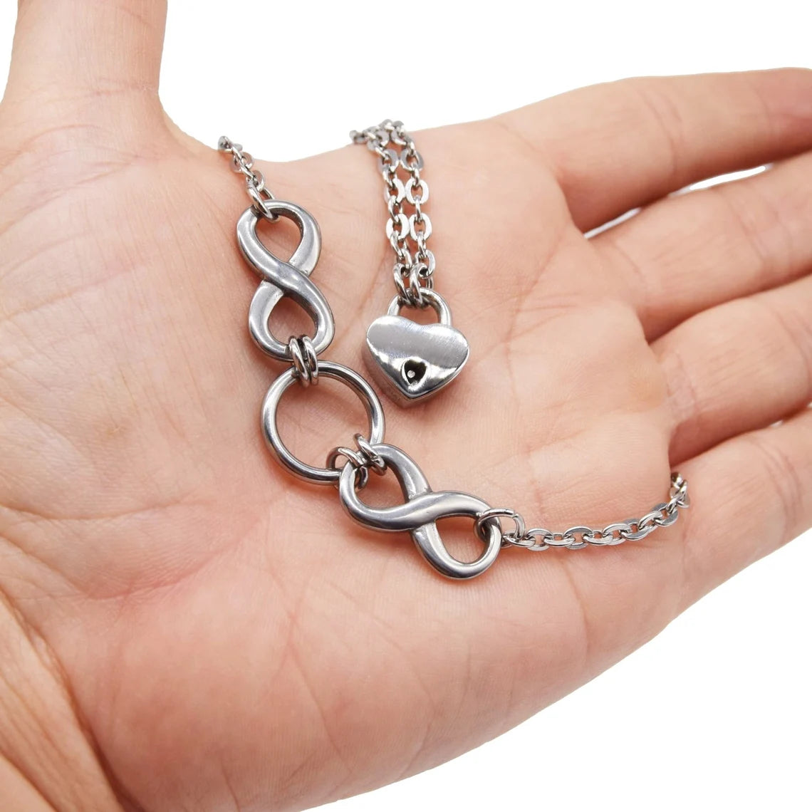 BDSM Locking Day Collar with O ring and Double Infinity on a models hand