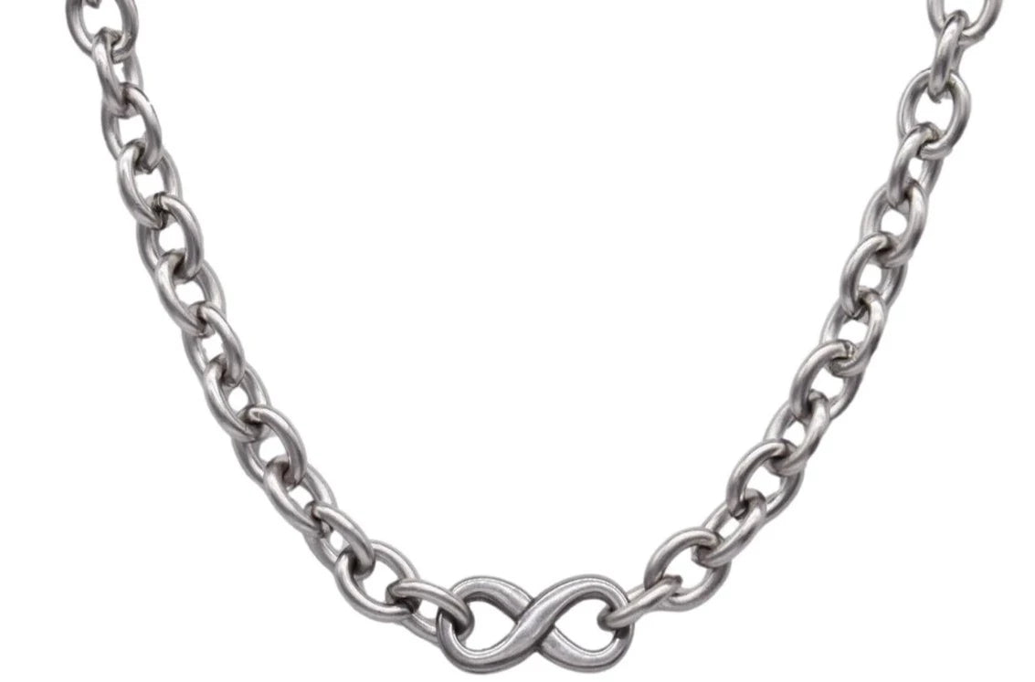 BDSM Locking  Heavy Day Collar Jewelry Infinity Necklace of Lock and O ring in solid 316L Stainless Steel on a white background