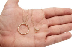 BDSM Locking Day Collar Jewelry Necklace of Lock and O ring available in solid 316L Stainless Steel or 925 sterling silver as well as rose yellow and white 14K gold shown on a models hand